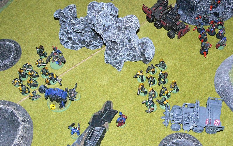 Orks swarm all over the surviving Space Marines