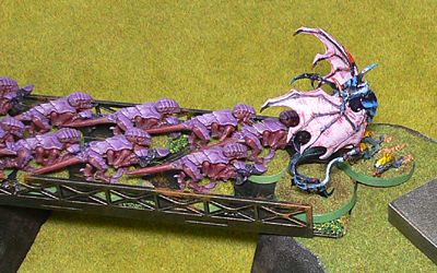 The Parasite Of Mortrex gatecrashes the fight between purple and red Termagants