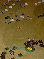 A Khorne force charges at an Imperial-held town